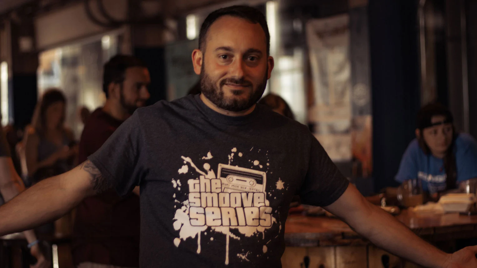 A fan wearing in The Smoove Series band merchandise